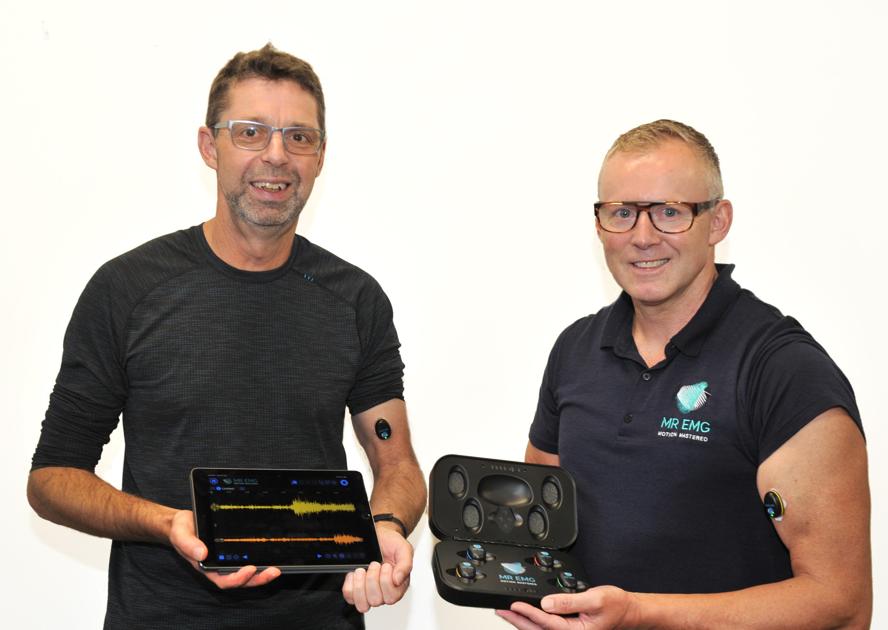 MR EMG co-founders Michael Macknight (left) and Rowan Ellis display their muscle output measuring...