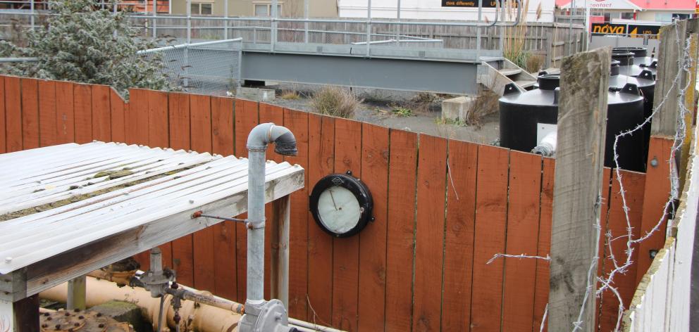 Over the fence abutting the Hillside Rd footpath to the former Dunedin Gasworks is an underground...