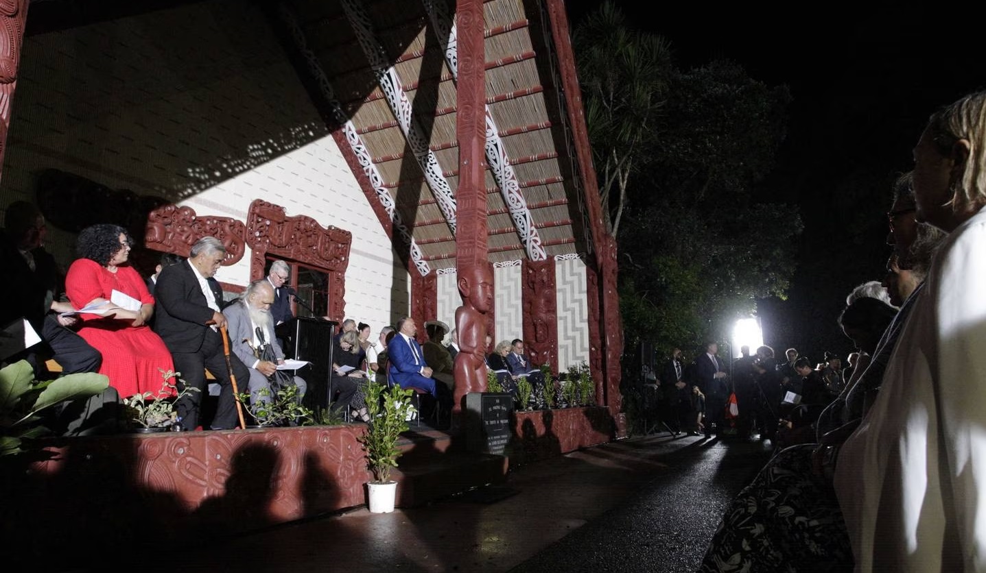 Leaders on the porch of the meeting house during the Waitangi Day dawn ceremony. Photo: NZ Herald