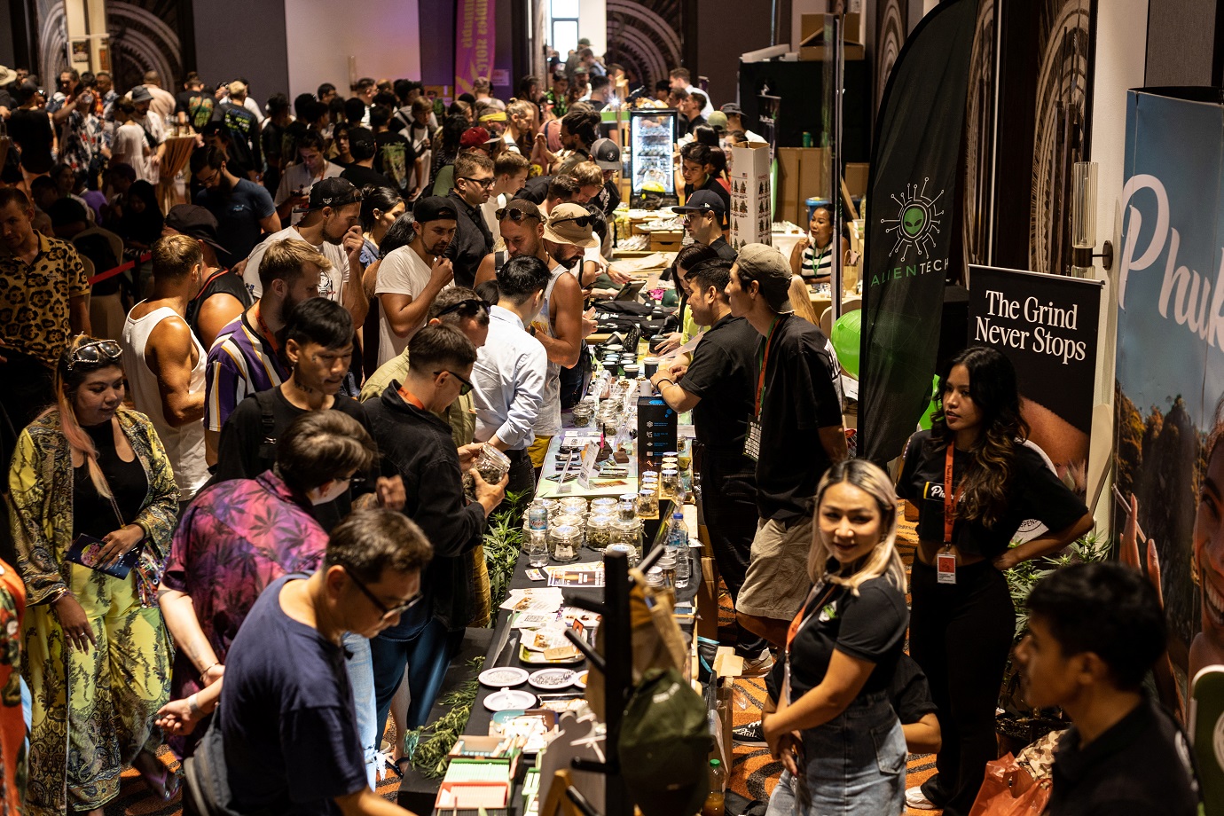 People walk near stands offering cannabis products. Photo: Reuters