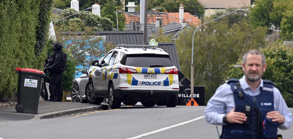 Armed police were seen descending on a property in Highgate, near Roslyn Village, last Tuesday...