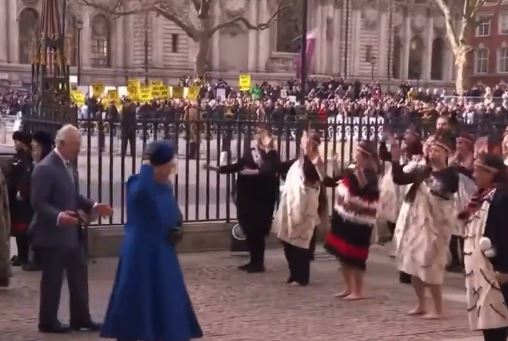 Queen Consort Camilla appeared to walk past the performers. Photo: Twitter