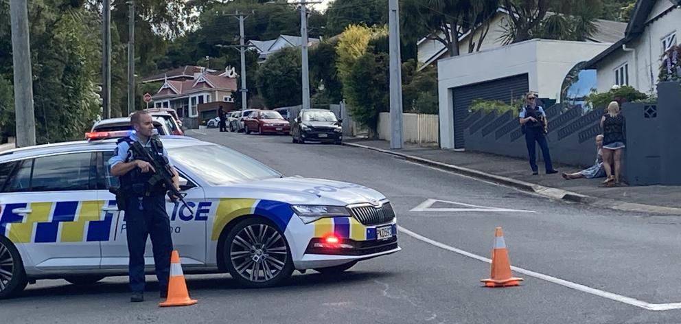 Armed police block off a street in the area on Friday. PHOTO: STEPHEN JAQUIERY