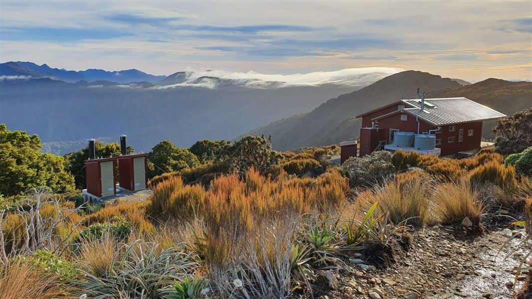 The Moonlight Tops hut overlooking Paparoa National Park. Photo: DOC 