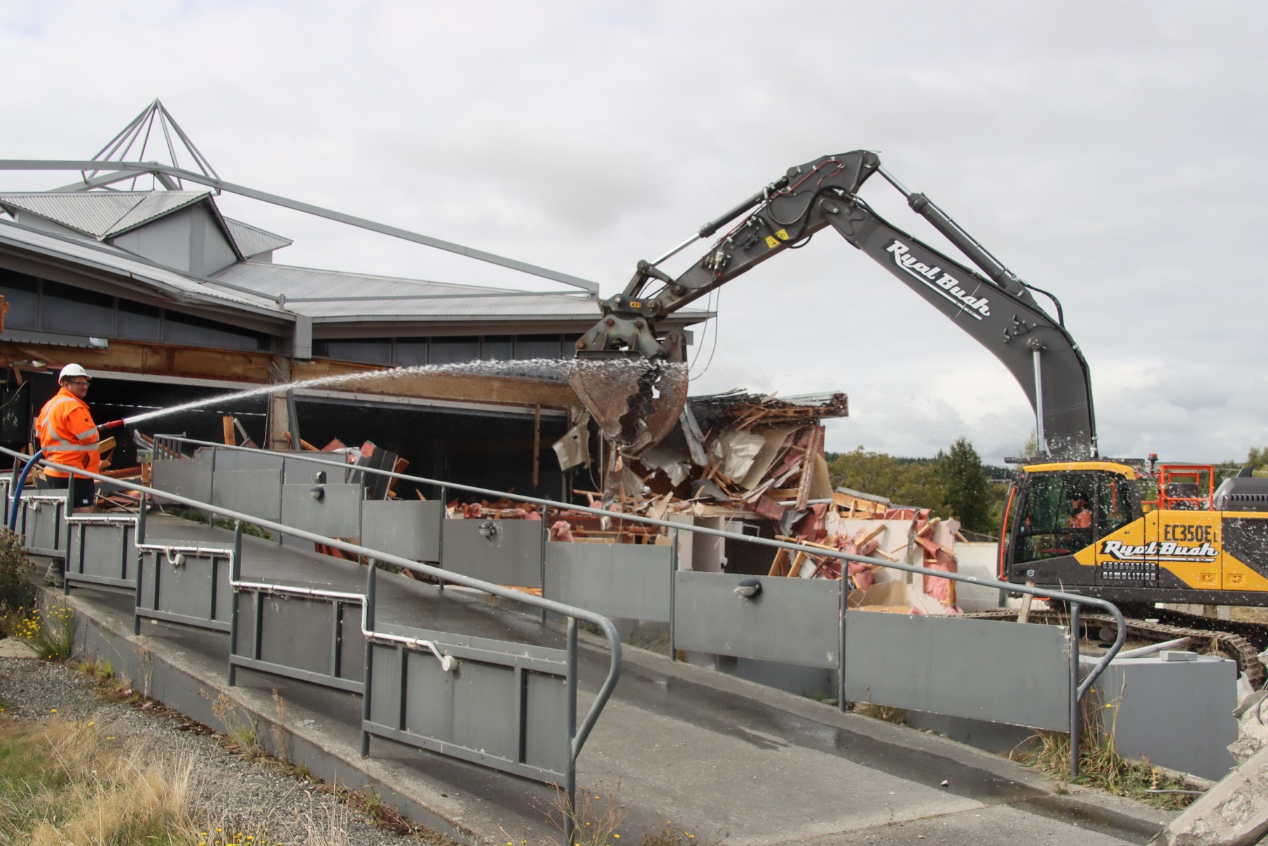 Ryal Bush Transport staff member Rob Drummond hoses down the site where excavator driver Rob...