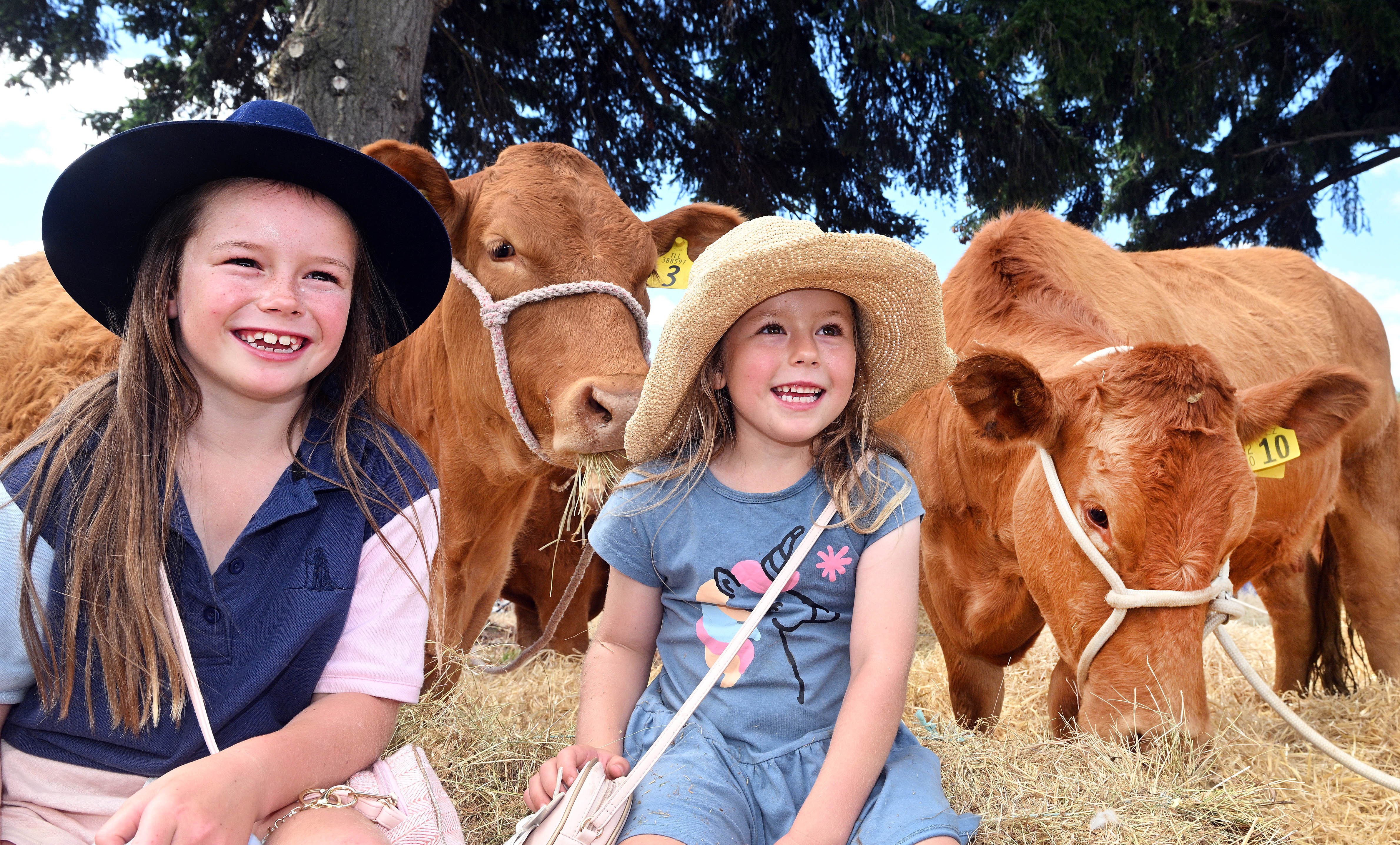 Scarlett (7) and Adaline (5) Smith, are keen young farmers, along with their two brothers, on...