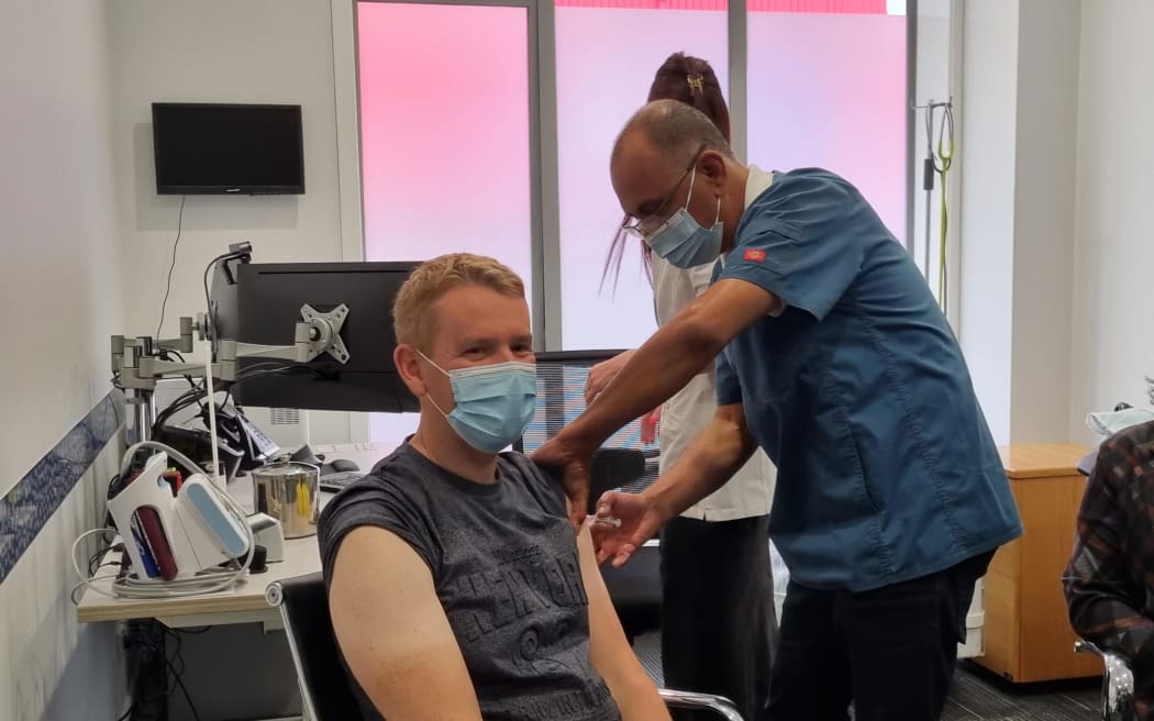 Prime Minister Chris Hipkins getting his flu vaccine and Covid booster shot at Queen Street...