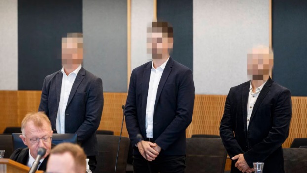 The men in the Christchurch District Court. While the case details can finally be reported, the...