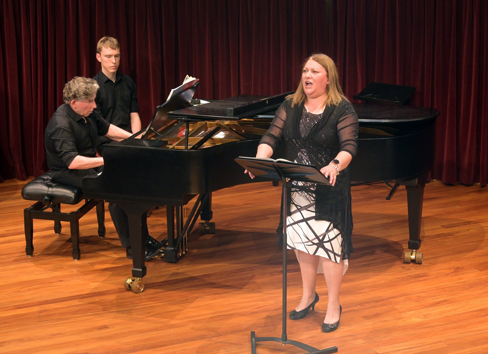 Soprano Rebecca Ryan, pianist Terence Dennis and page turner Cameron Monteath perform in a...