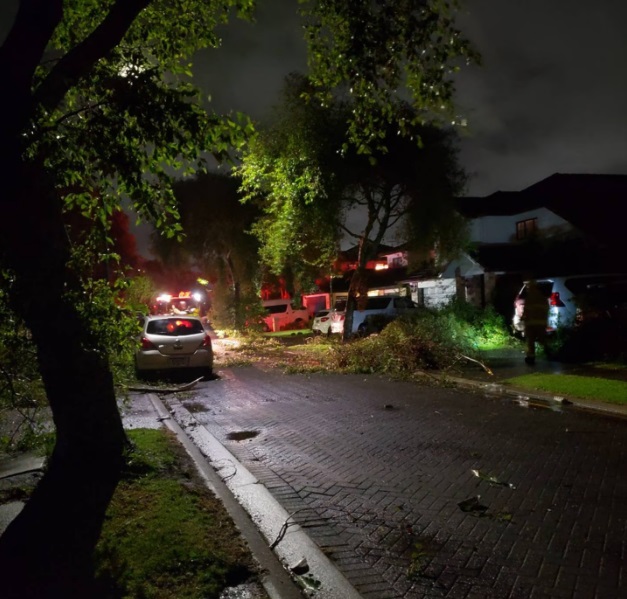 Debris on the road in Erne Cres in East Tamaki after the tornado struck on Sunday night. Photo /...