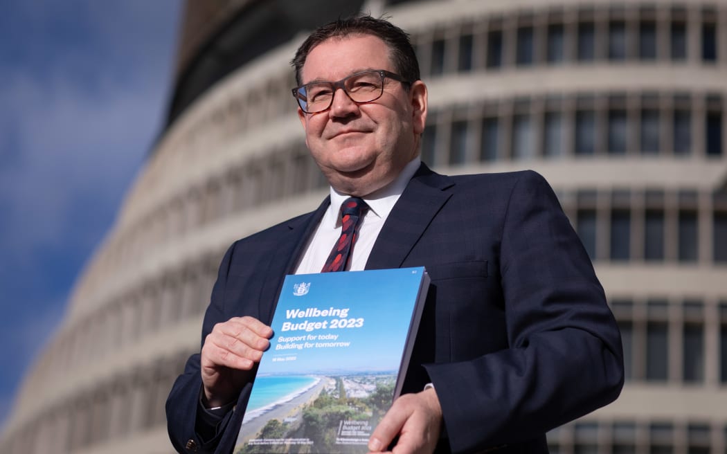 Finance Minister Grant Robertson, pictured with Budget 2023 on Wednesday morning. Photo: RNZ 