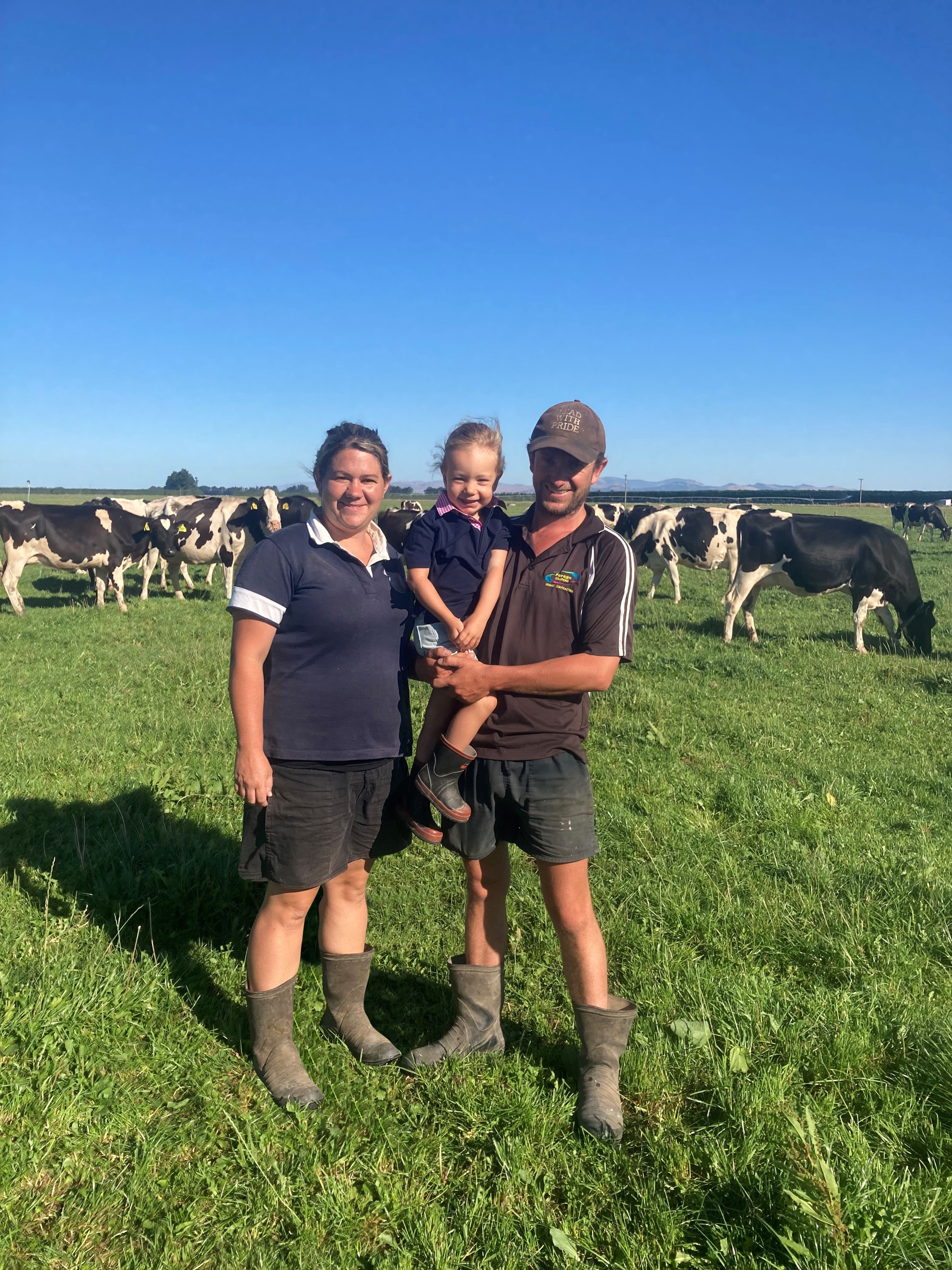 .Rangiora dairy farmers William and Louise Bailey, holding daughter Stella, have joined forces with their families to carry on a well-established Holstein Friesian stud. PHOTO: HOLSTEIN FRIESIAN NZ