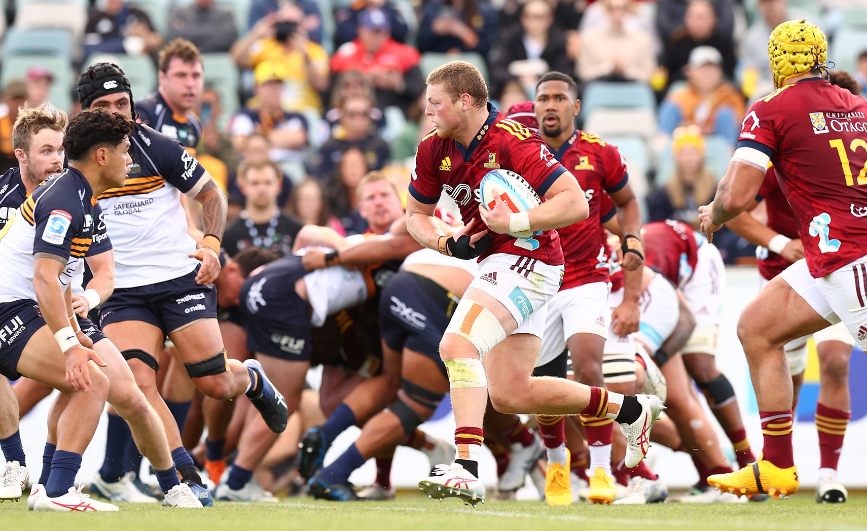 Scott Gregory of the Highlanders runs the ball during the round 12 Super Rugby Pacific match...