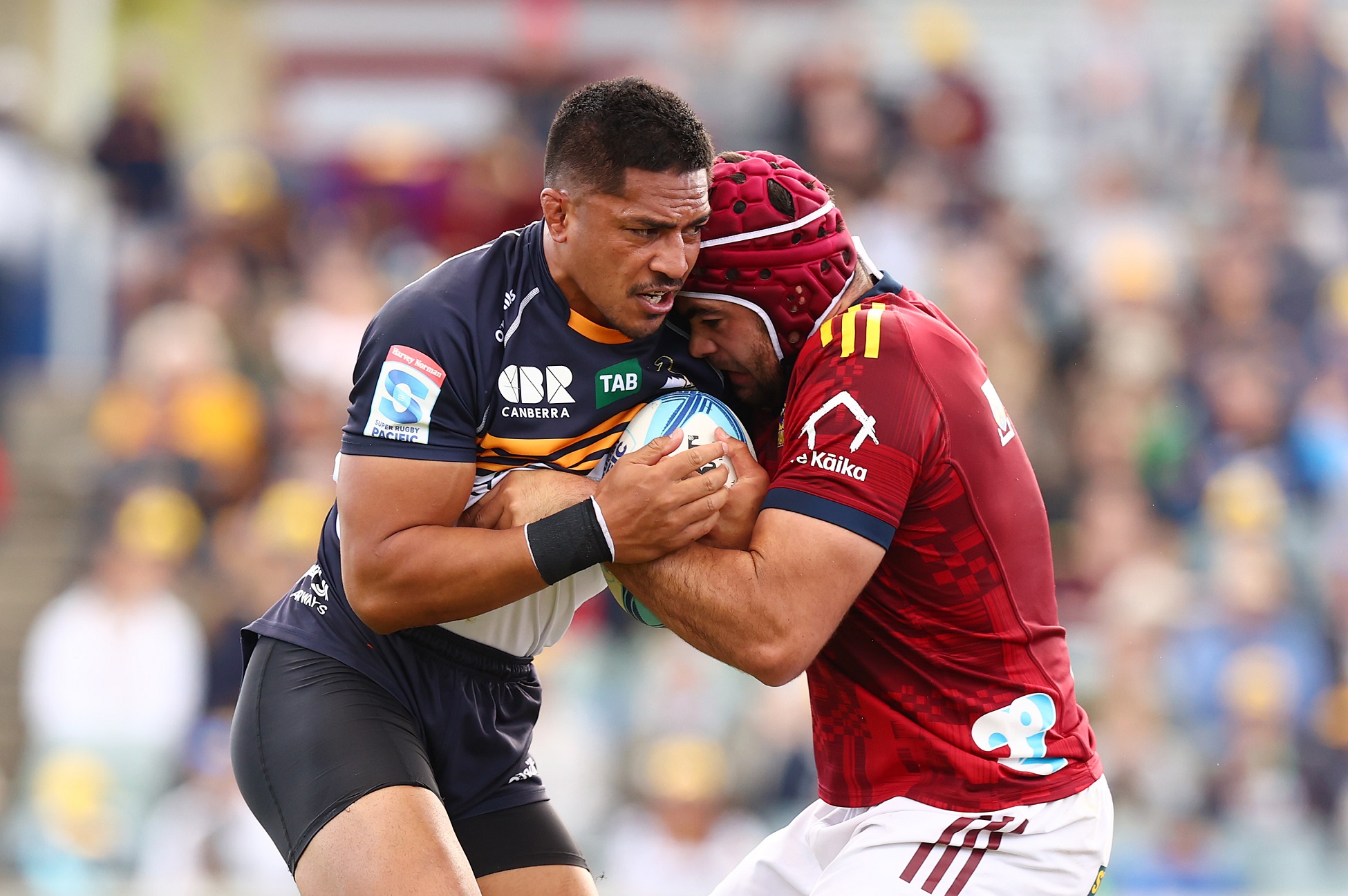 Pete Samu of the Brumbies is tackled by Billy Harmon of the Highlanders. Photo: Getty Images