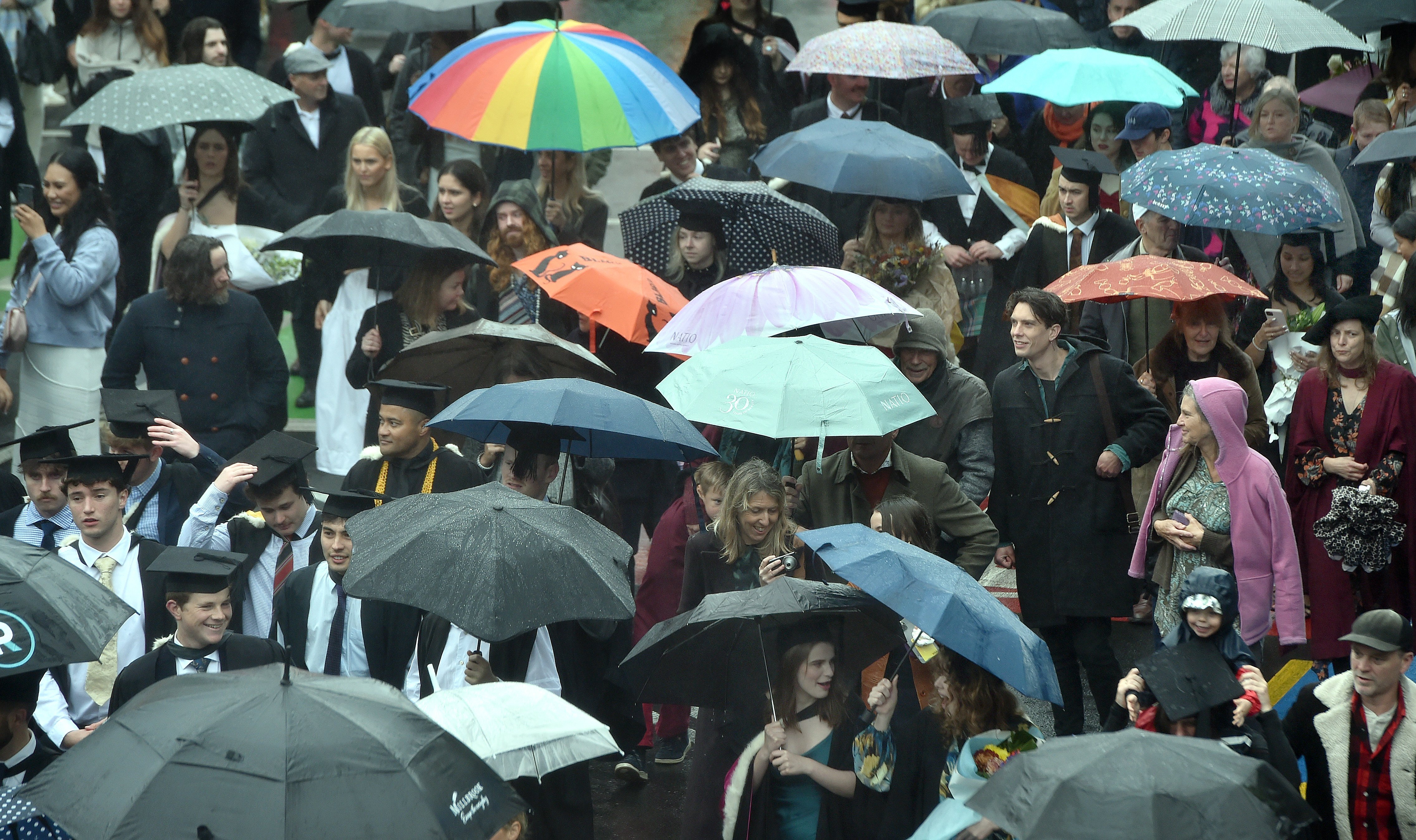 Lots of smiles, cheerful faces, and umbrellas fill Dunedin on Saturday as the University of Otago...