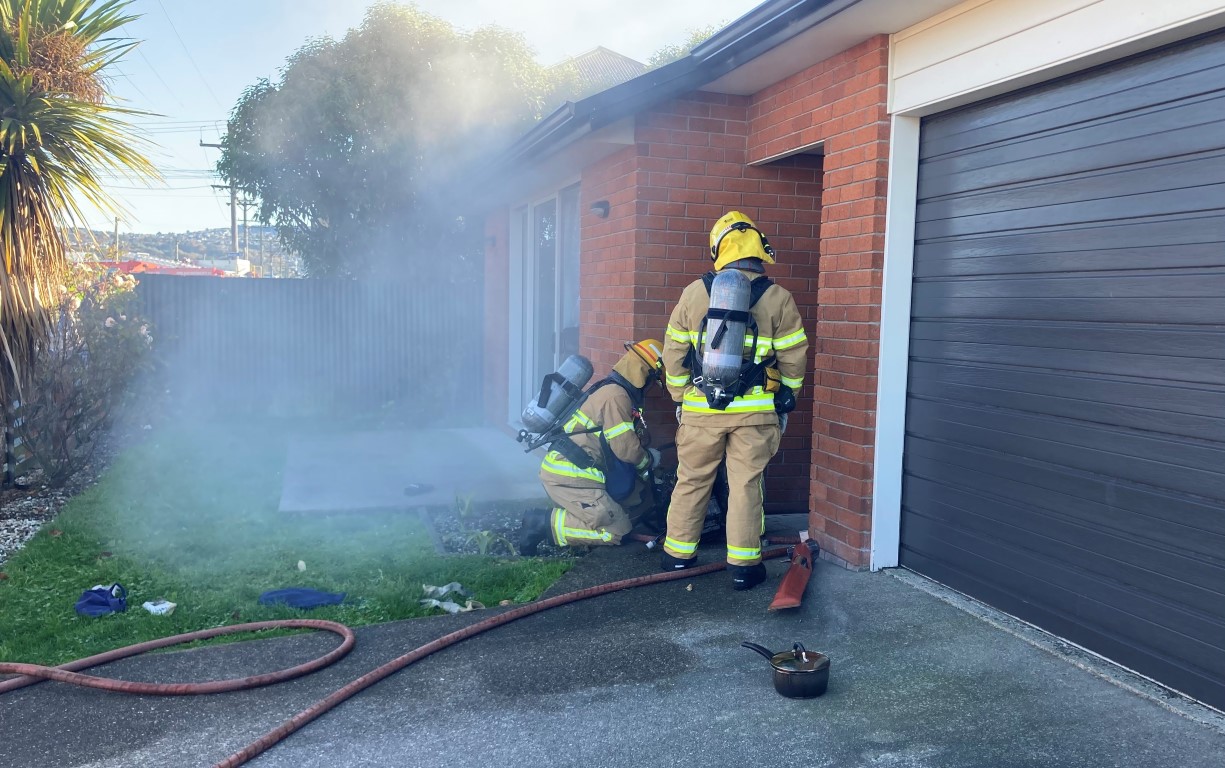 Firefighters at the scene in Tedder St this morning. Photo: Stephen Jaquiery