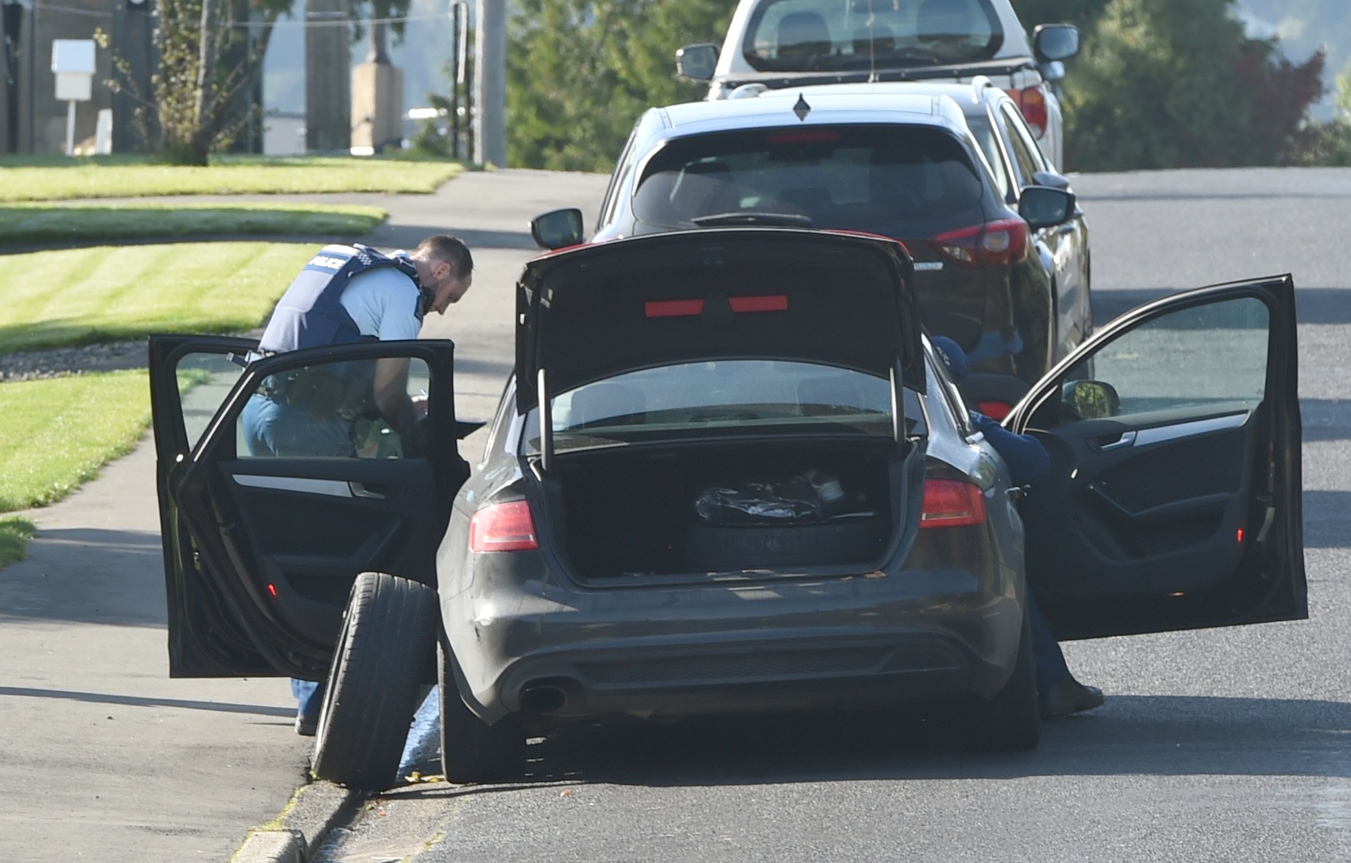 Police search the vehicle in Fairfield on Monday morning. Photo: Gregor Richardson