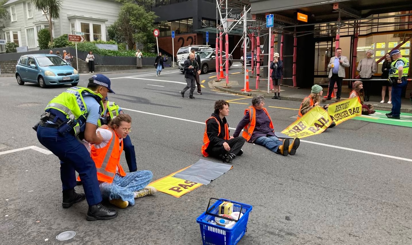 Police prepare to remove a protester blocking The Terrace in Wellington. Photo: NZ Herald