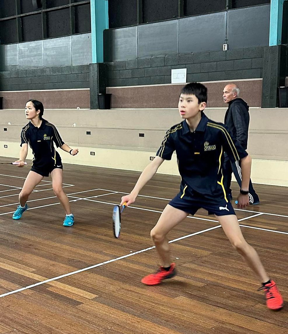 Oil Pathchotinont (left) and Jayden Lu, with coach Jim Hoffman in the background, practise at...