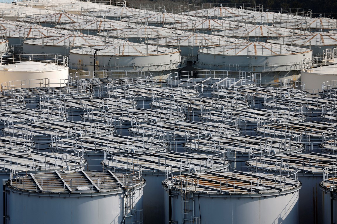 Tanks containing water from the disabled Fukushima Dai-ichi nuclear power plant are seen at the...