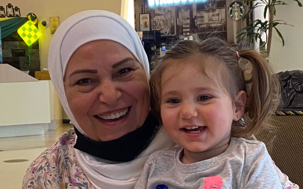 Hala's mother Mayada Kerdmsesto with granddaughter Tia when they met in Malaysia. Photos: supplied