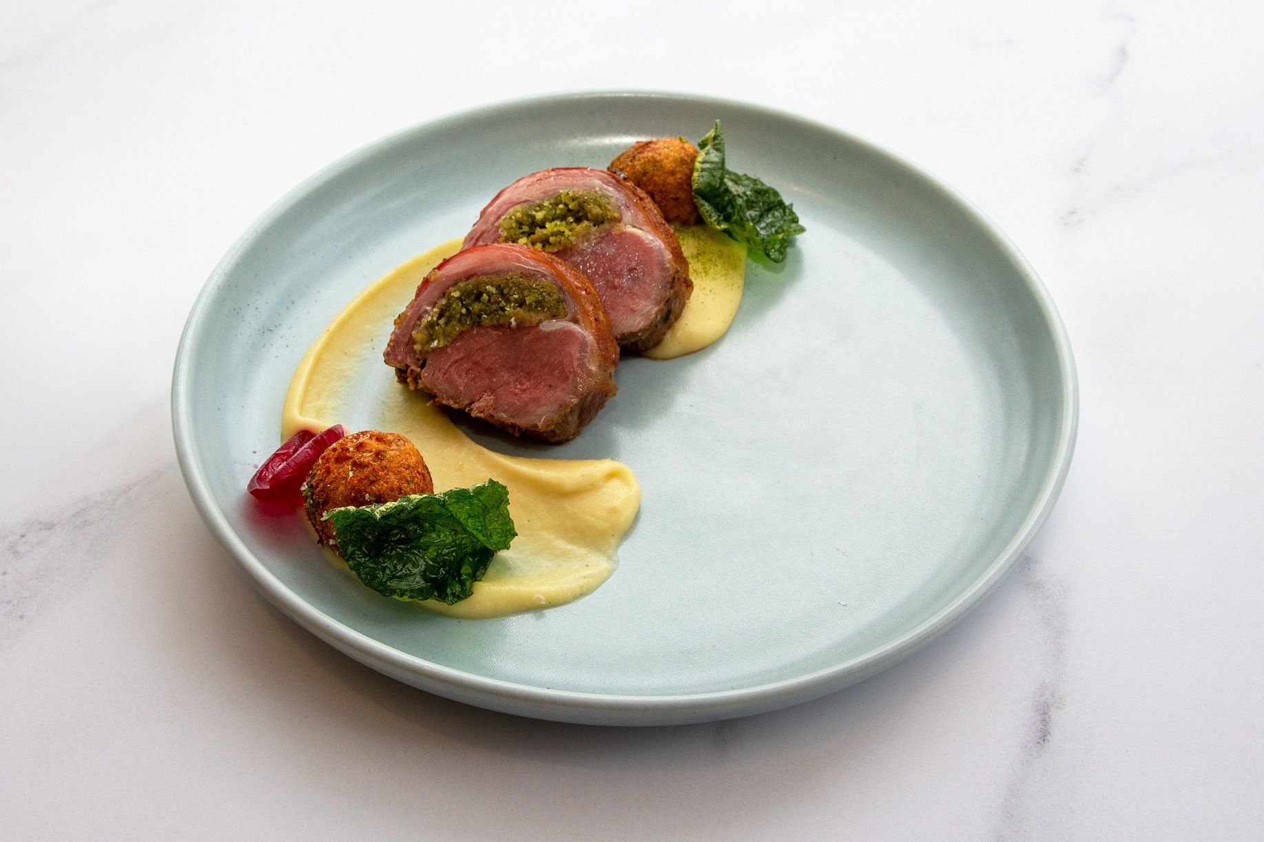 Nic Kearney’s winning dish — stuffed lamb saddle with kawakawa, parsnip and lamb neck beignet.