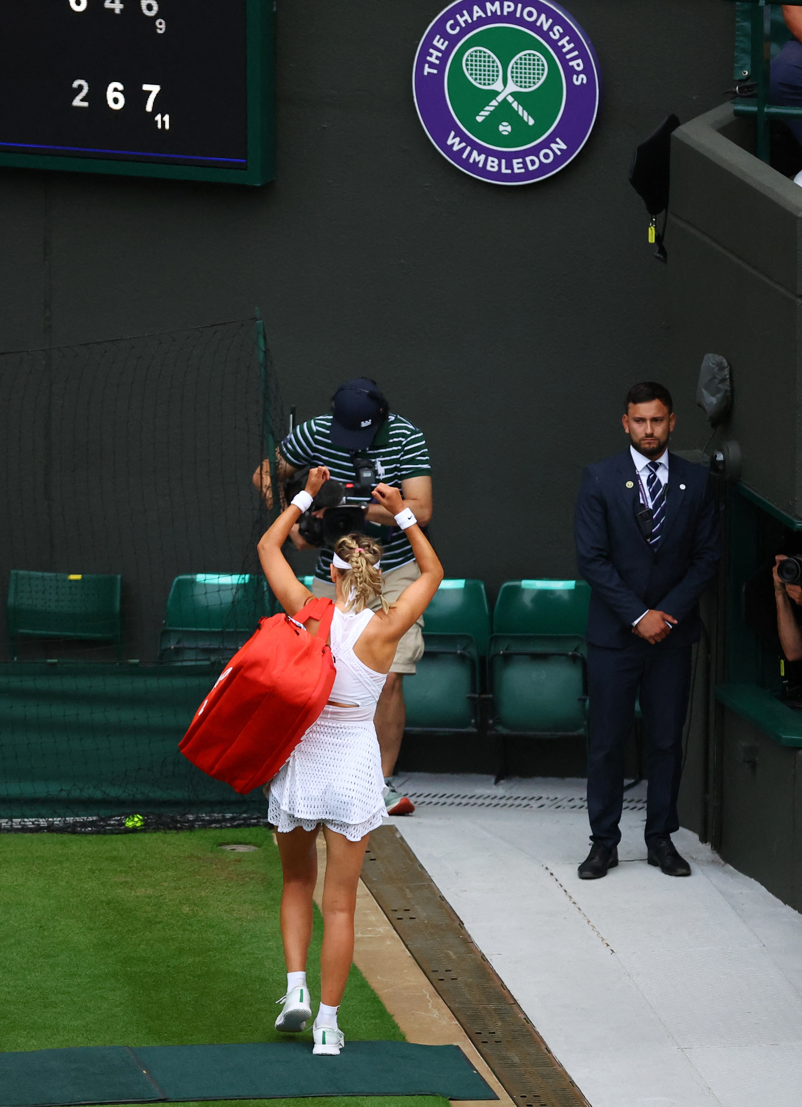 Victoria Azarenka gestures as she leaves the court after losing to Ukraine's Elina Svitolina....