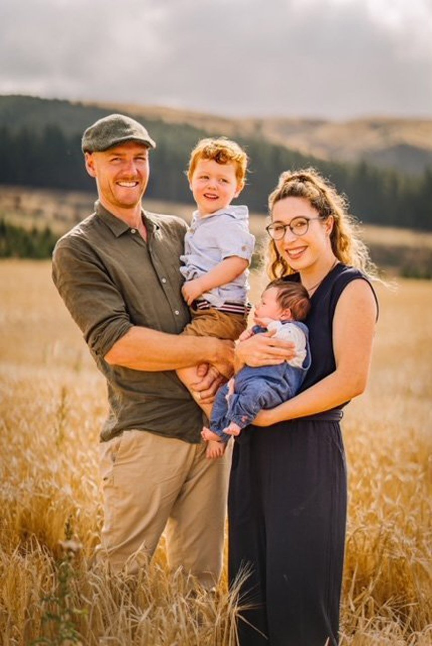 Rob Hewett, holding son Walter, and Helena Robinson with baby Ted, on their Dunback farm.