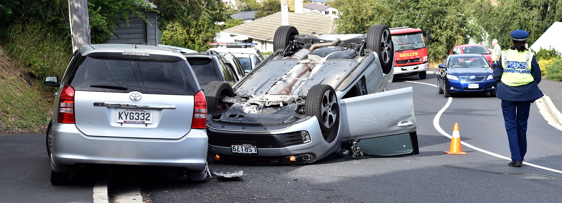 A stolen car ends up on its roof. Photo: Peter McIntosh/ODT files