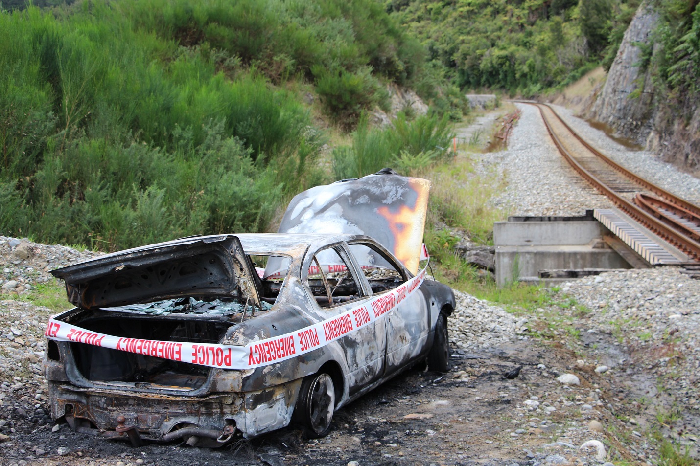 A burnt out wreck wrapped in police tape. Photo: Greymouth Star/ODT files