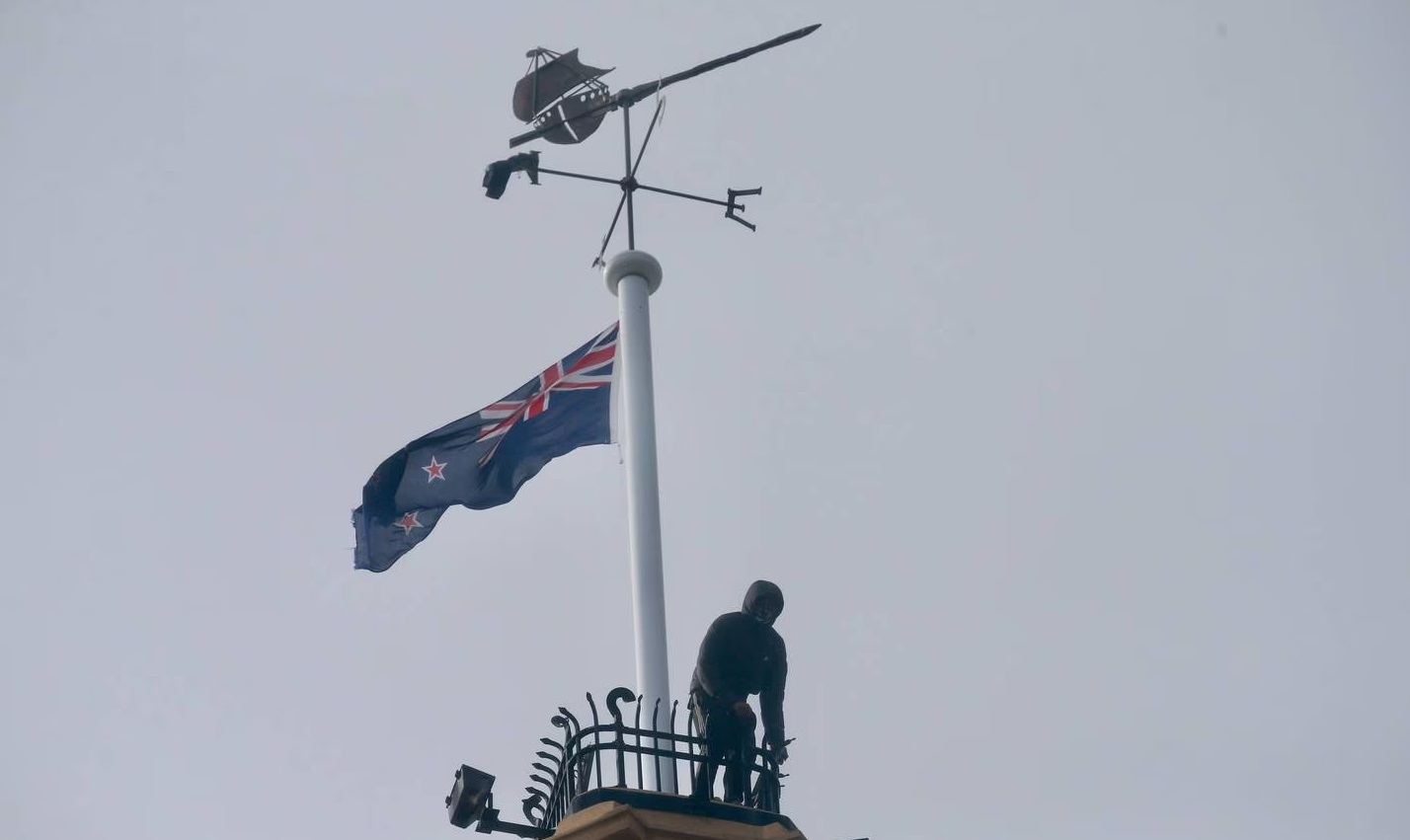 Part of downtown Auckland was cordoned off after two men scaled the Ferry Building on Quay St...