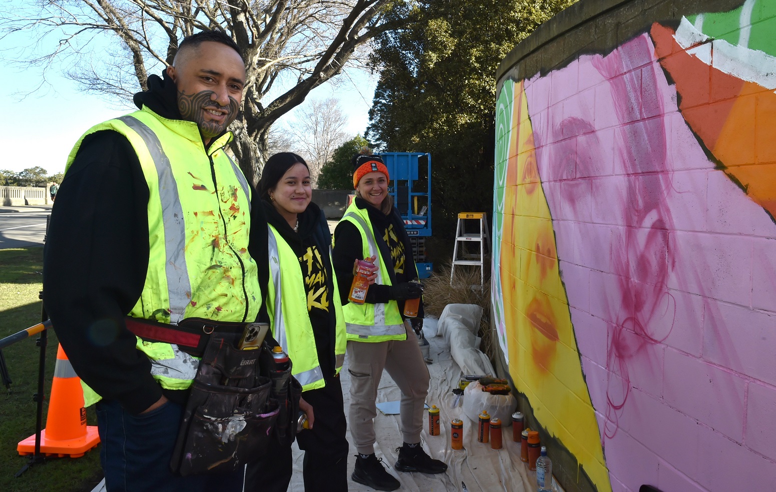 Painting a mural in Anzac Ave for the Fifa Women’s World Cup are (from left) Graham Hoete, who...