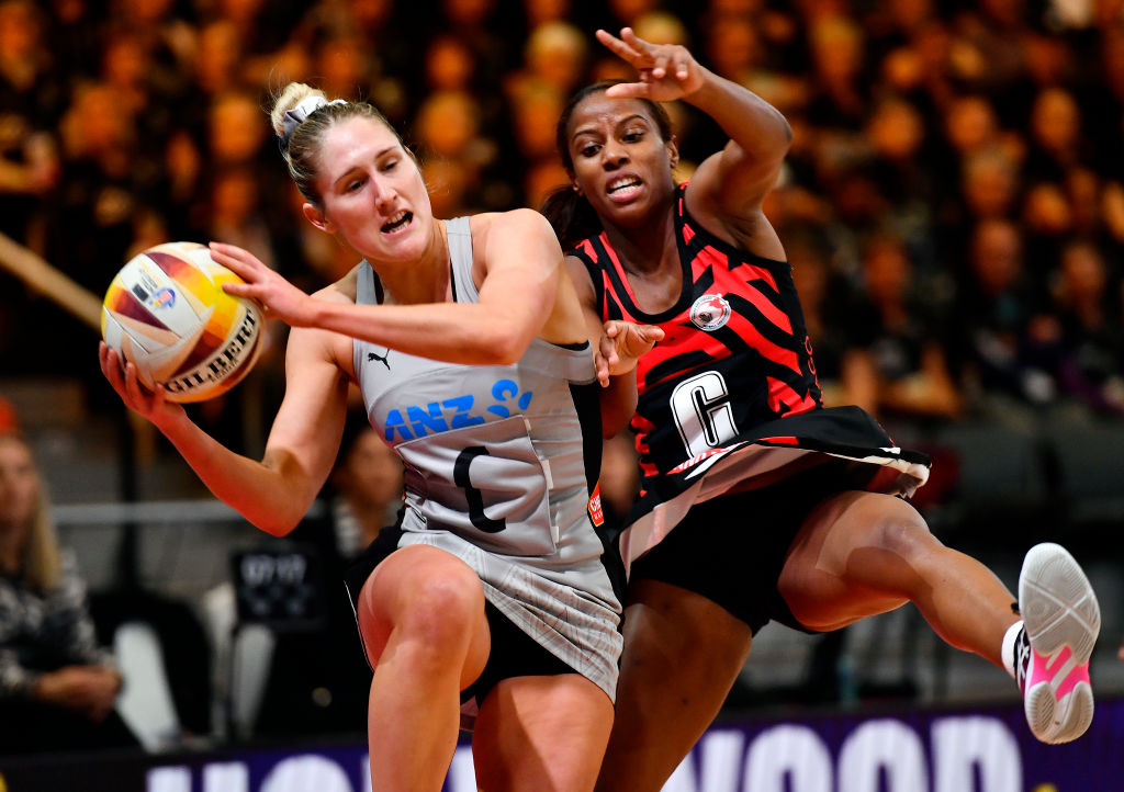 Alena Brooks of Trinadad and Tobago tries to disrupt Silver Fern Maddy Gordon during their match...