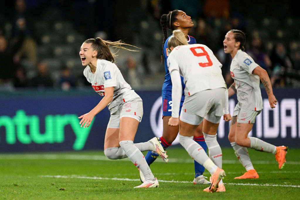 Switzerland's Seraina Piubel (1st L) celebrates with teammates after scoring her team's second...