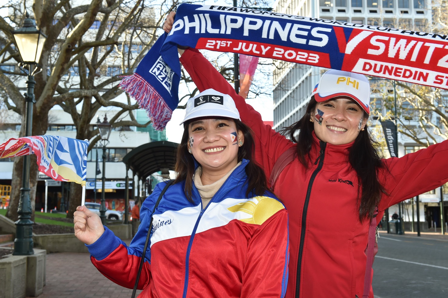 Philippines fans Marian Nipal (left) and Princess Arenas show their support in the Octagon before...