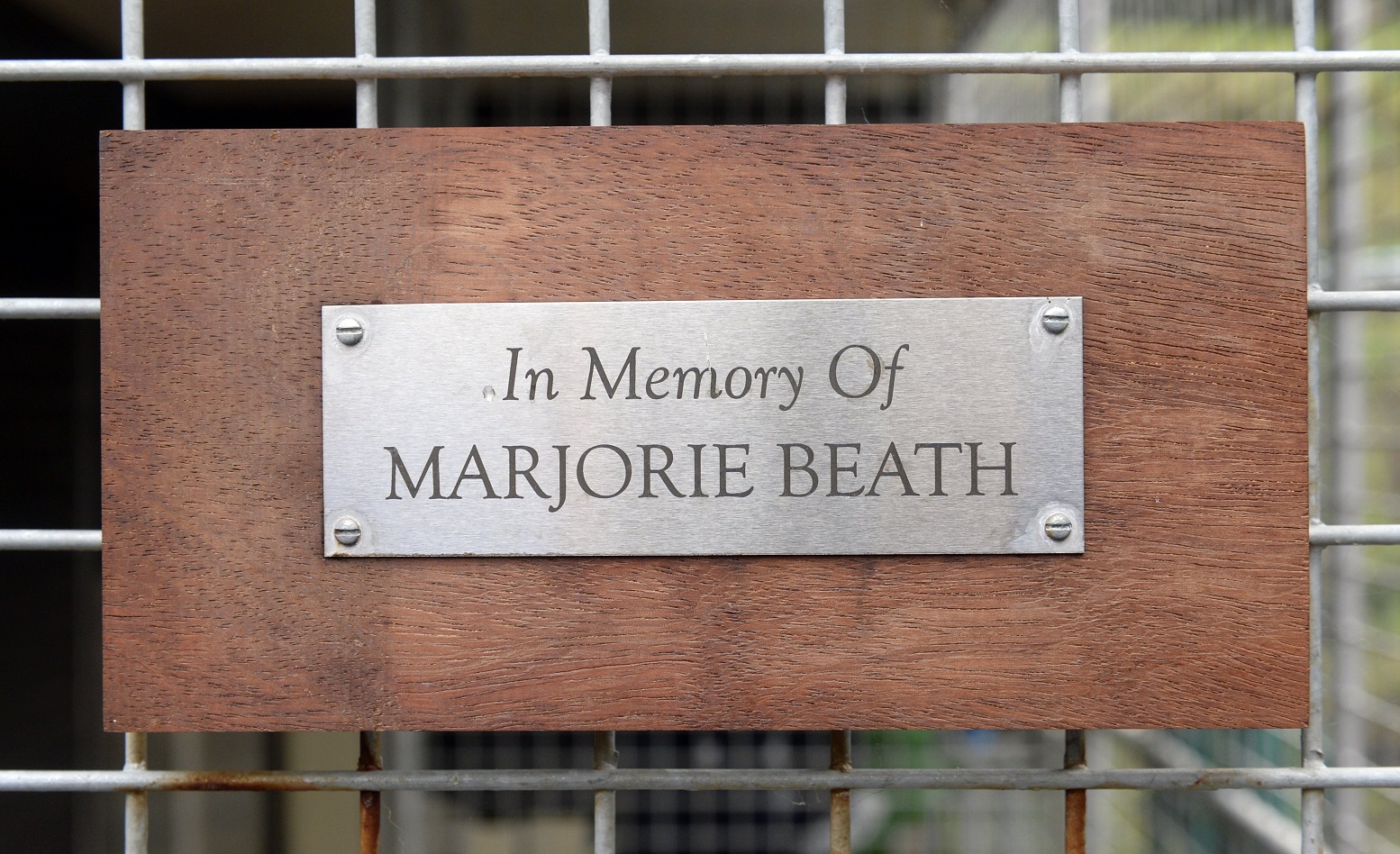 A plaque in Marjorie Beath’s memory has been placed outside the new puppy pen.