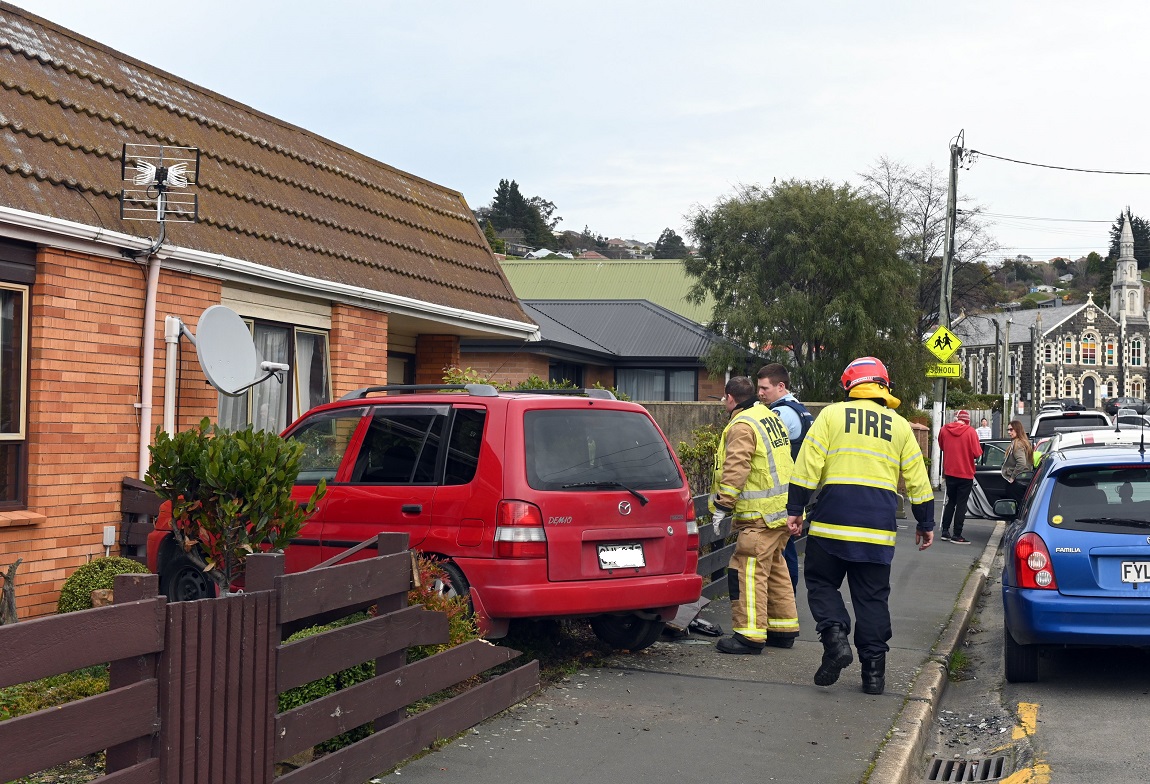 The crash ended with one of the vehicles crashed through a fence in Caversham. Photo: Linda...