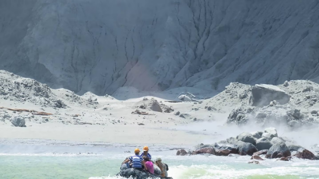 Tourists are ferried off Whakaari/White Island after the eruption. Photo: Michael Schade/NZME