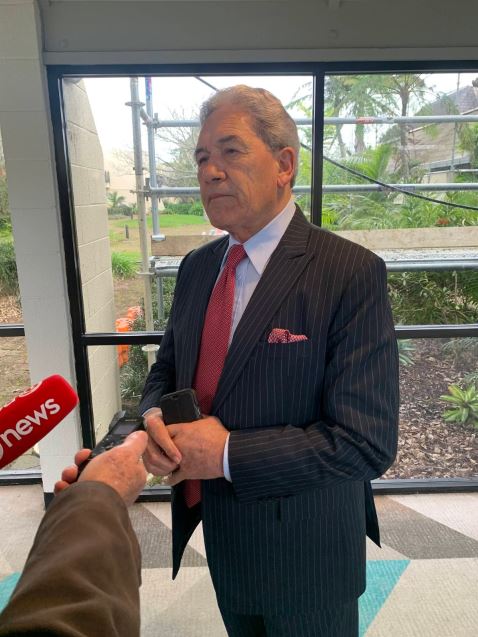 NZ First leader Winston Peters speaks with media at his party's convention. 