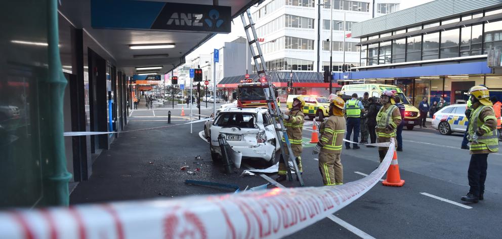 Cars were damaged by a runaway truck which narrowly missed pedestrians after rolling down George...