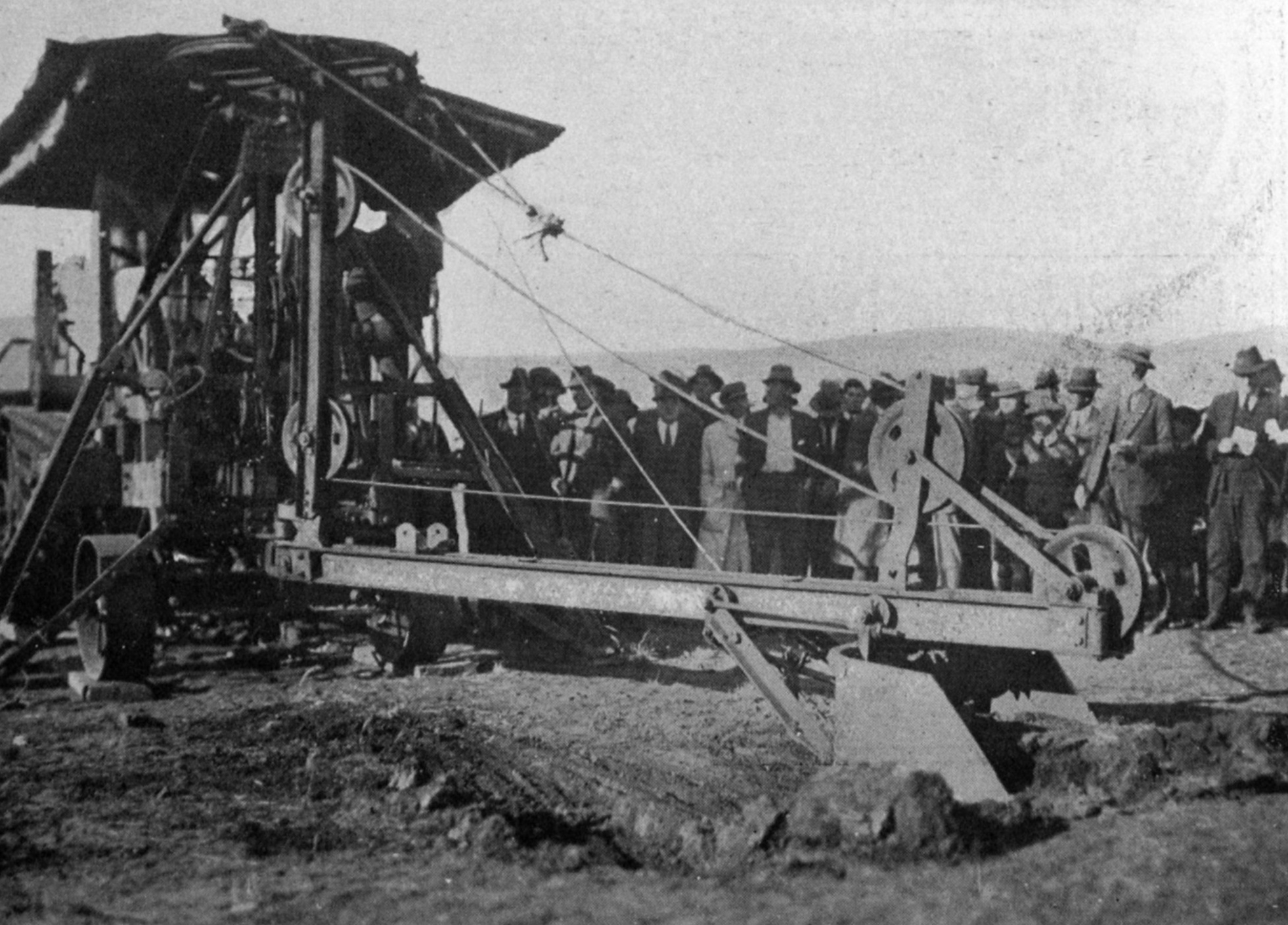 Percy Gerald Stewart,  Australian federal minister for works and railways, uses a steam shovel to...