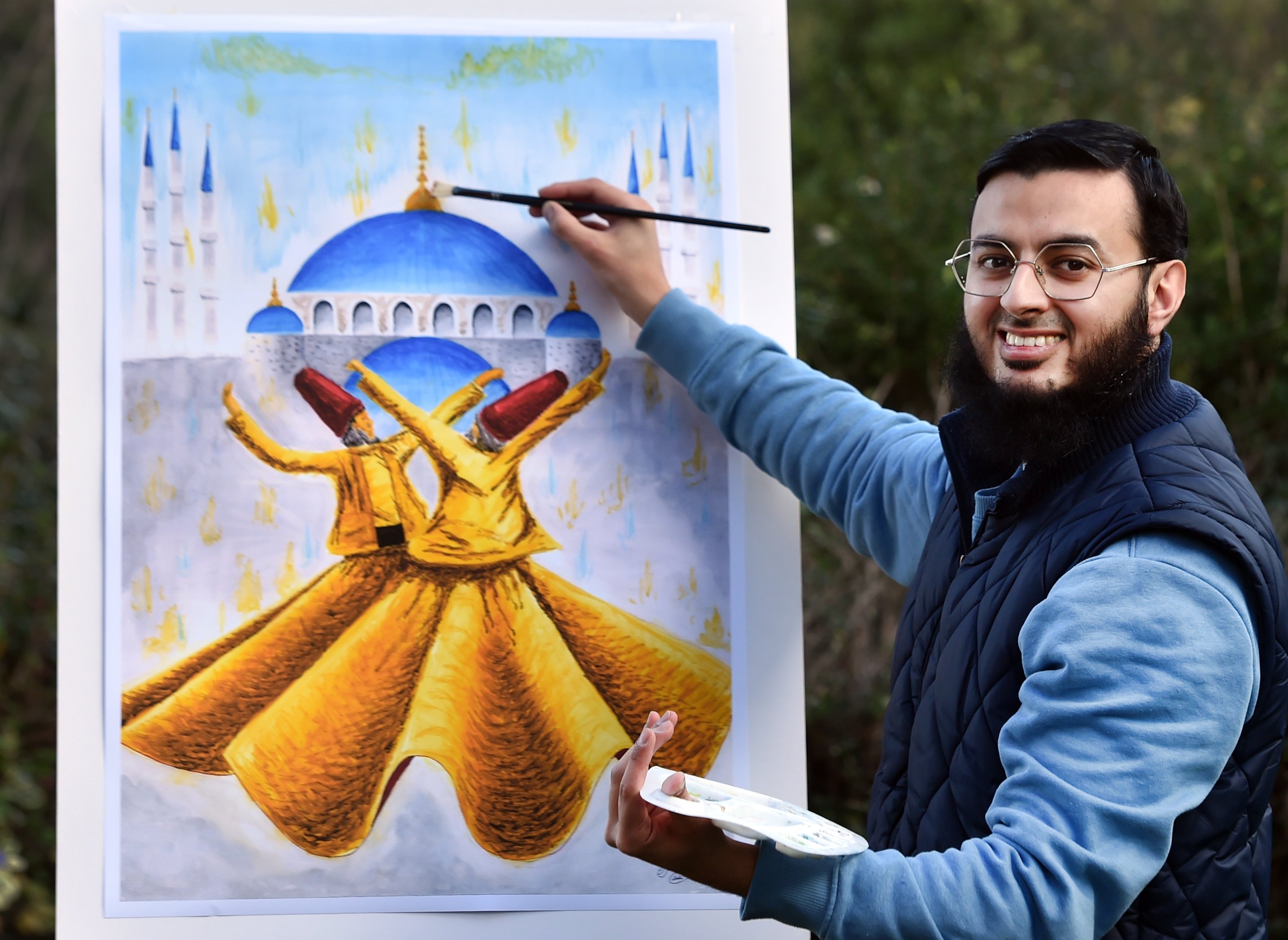 Pakistan Association of Otago arts and culture head Dr Asrar Elahi with one of his artworks which...