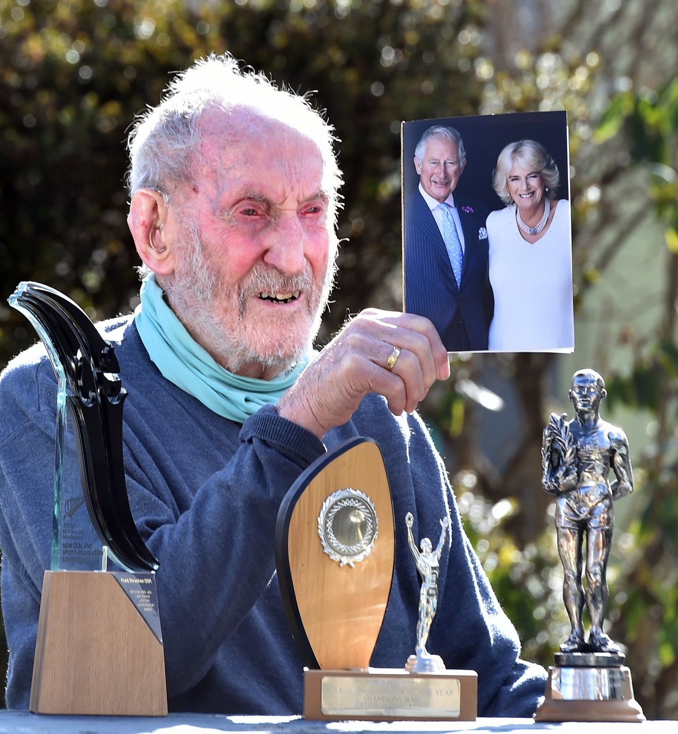 Fred Strachan celebrates his 100th birthday surrounded by his many achievements and a card from...