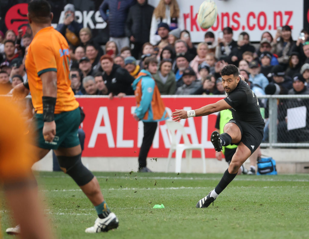 Richie Mo’unga kicks the winning points for the All Blacks at Forsyth Barr Stadium. Photo: Getty...