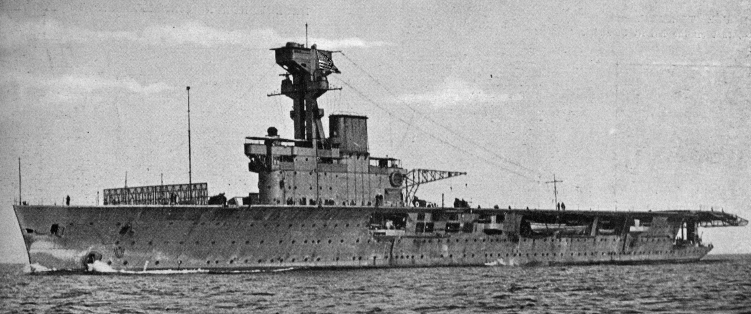 The Royal Navy aircraft carrier HMS Hermes, at steam trials on the Cornish coast, flies an...