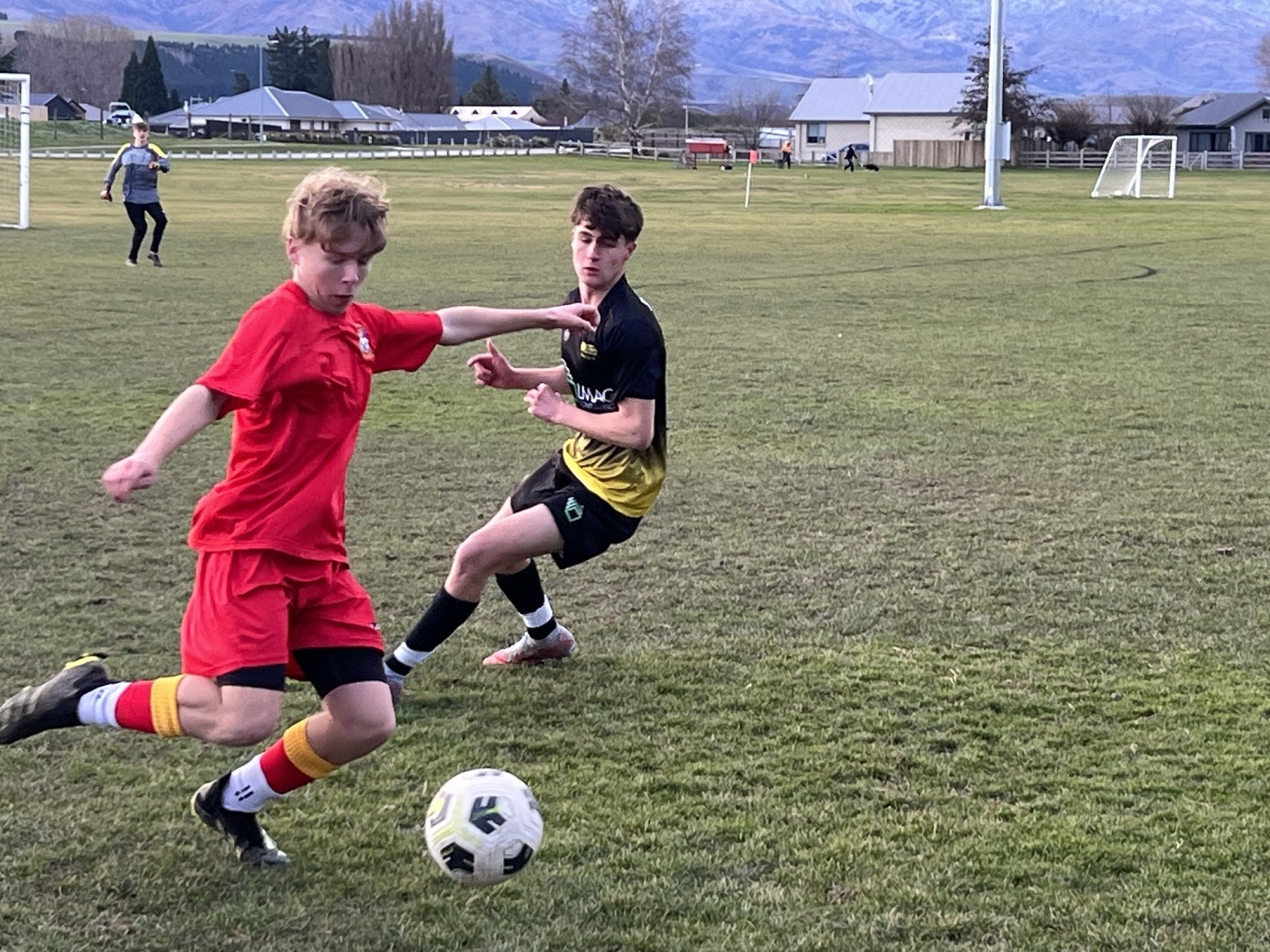 Nate Unsworth (Dunstan, left) tries to beat Zavier Taylor (Mount Aspiring College) during an...