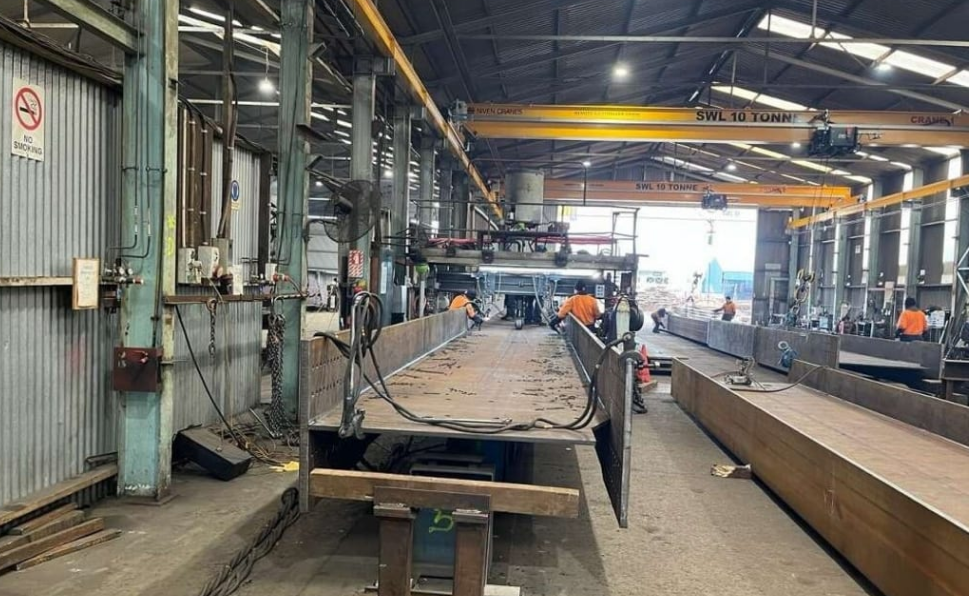 The first of 15 bridge beams being fabricated by teams working around the clock in Napier. Photo:...