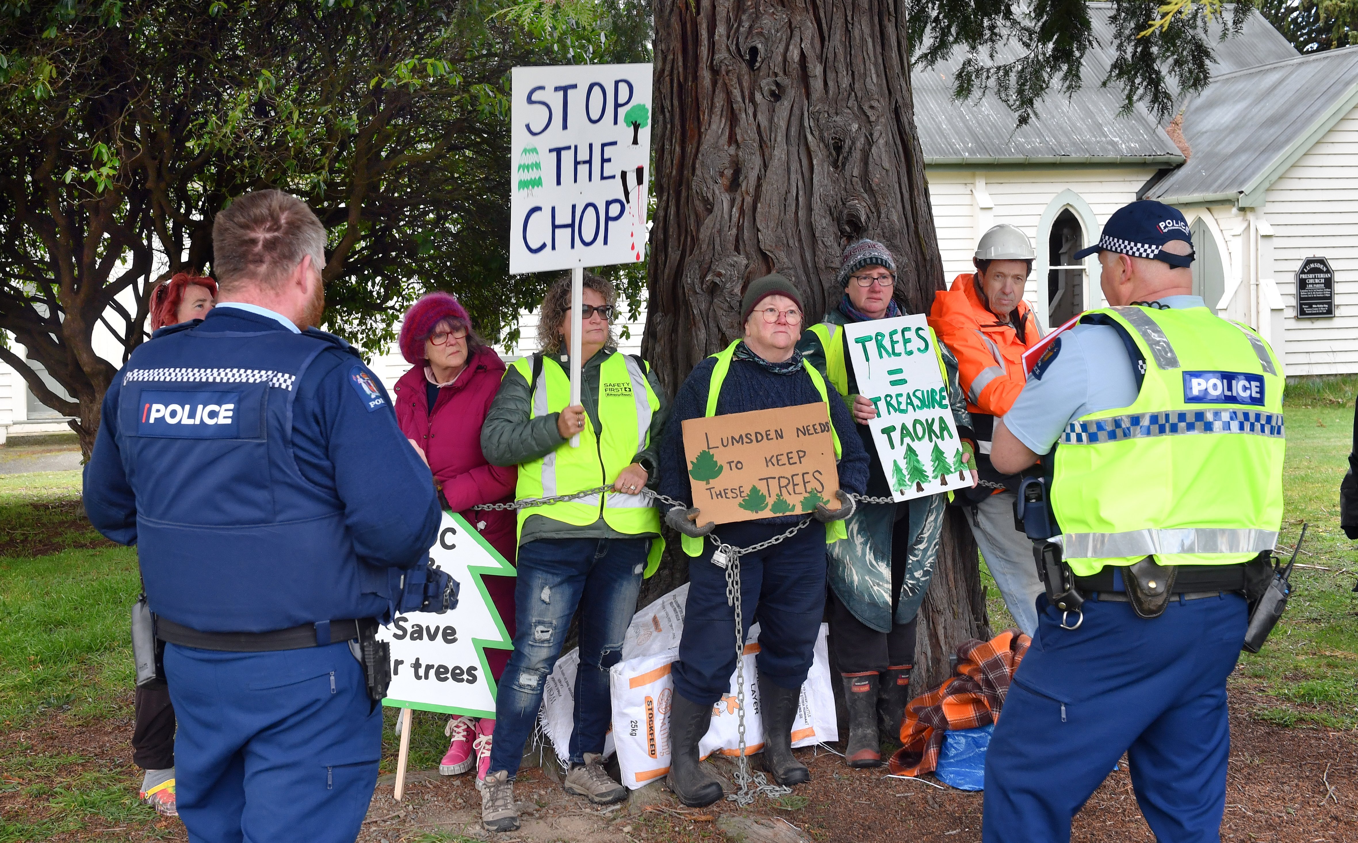 Police negotiate with protesters (from left) Tess Thurlew (obscured), Alison Beaumont, Kim...