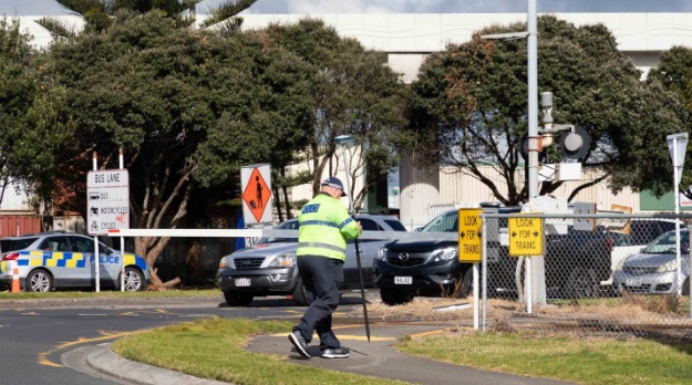 Police at the railway crossing on Hewletts Rd where a person was hit by a train and died on...