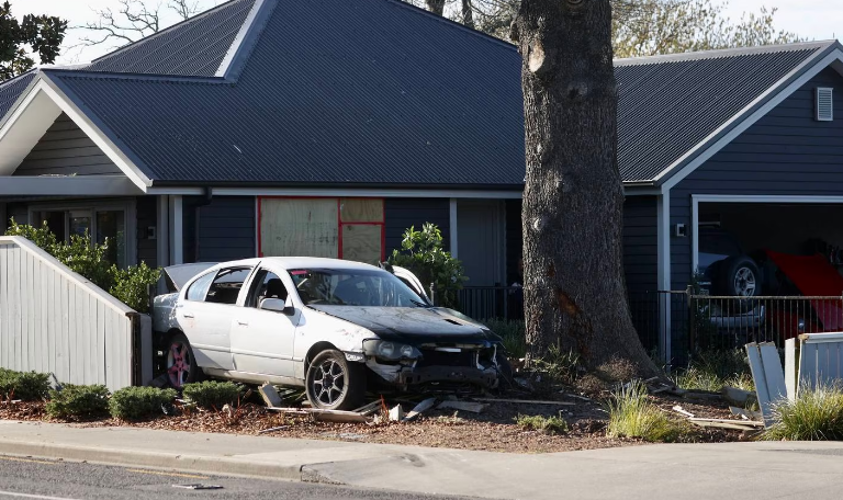 The car  hit a tree and then crashed into a house in McIvor Place. No one in the home was hurt....